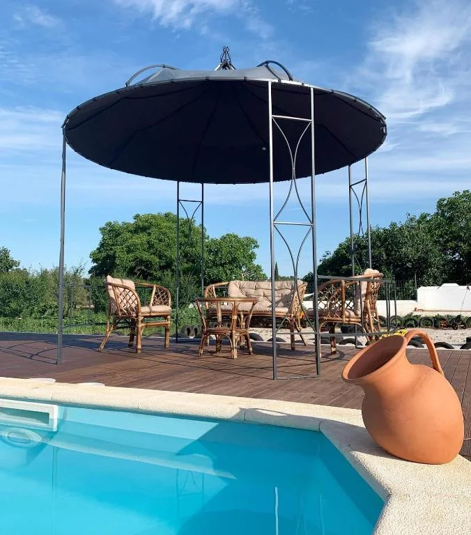Outdoor pool and sun terrace at Herdade Da Maridona