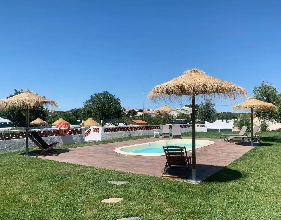 Swimming pool and shaded loungers